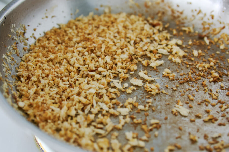 Browning breadcrumbs in a pan until toasted and fragrant.
