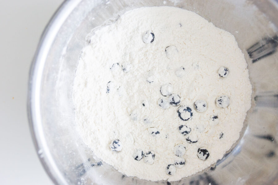 Tossing the blueberries with the dry ingredients first helps them mix into the pancake batter better.