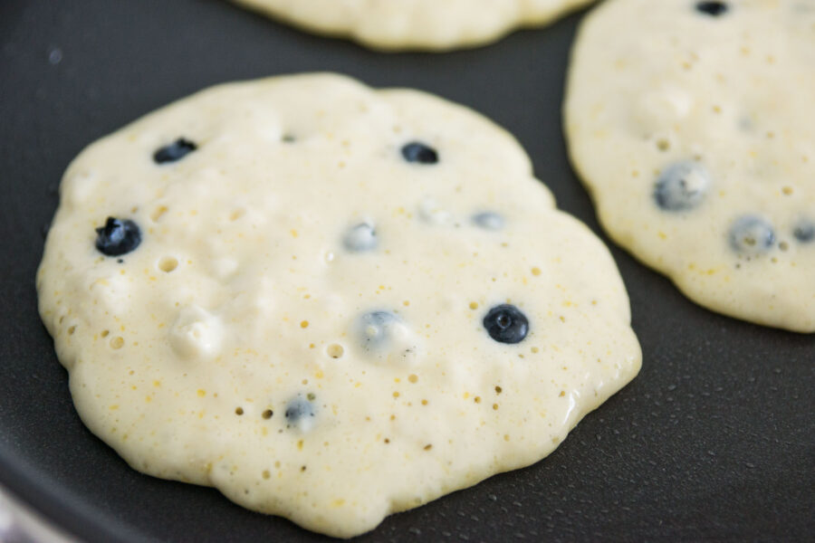 Bubbles rising to the surface indicate the pancakes are ready to flip