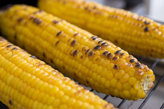 Charred ears of sweet corn.