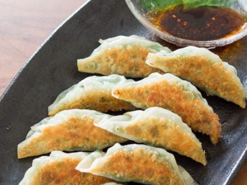 Shiso gyoza on a plate.