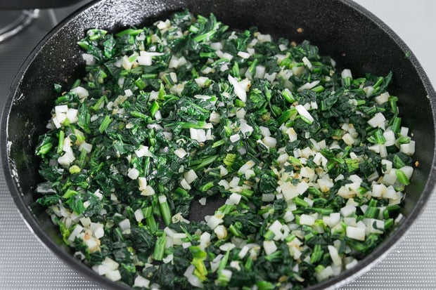 Cooking the spinach and vegetables.