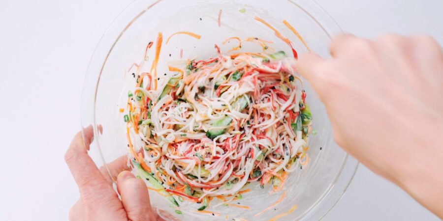 Mixing Kani Salad together.