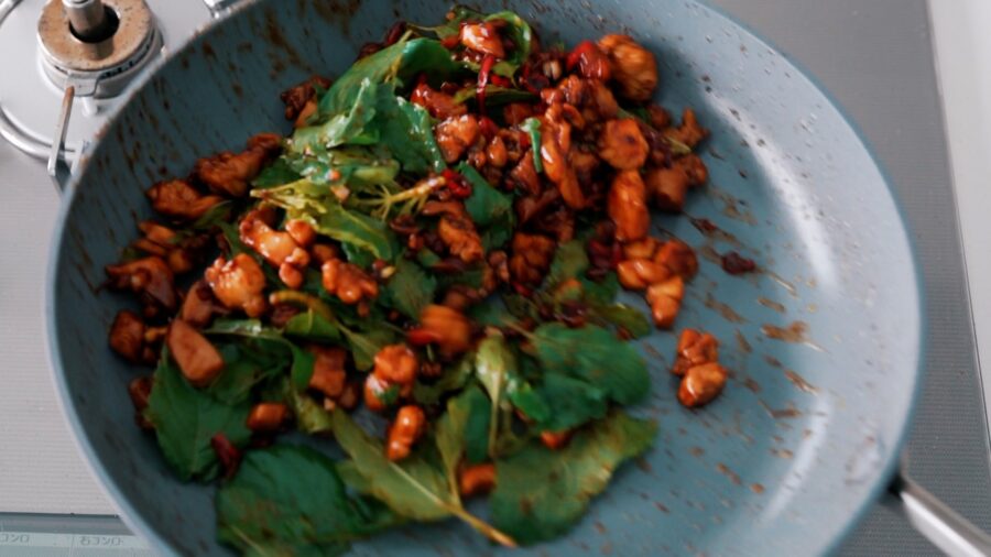Tossing Holy Basil with Chicken for Pad Kraprow Gai
