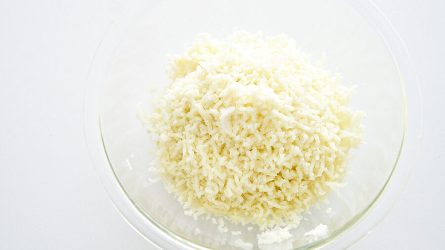 Mash the potatoes, or pass them through a potato ricer.