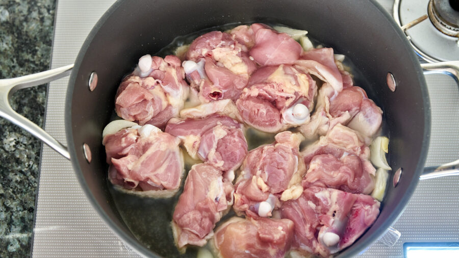 For the best Chicken Rendang, brown the chicken before caramelizing the spice paste.