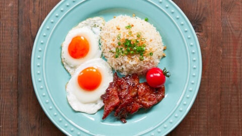 Tosilog is a classic Filipino breakfast combo made with Tocino (Filipino bacon), Sinangag (garlic fried rice) and Itlog (fried eggs)