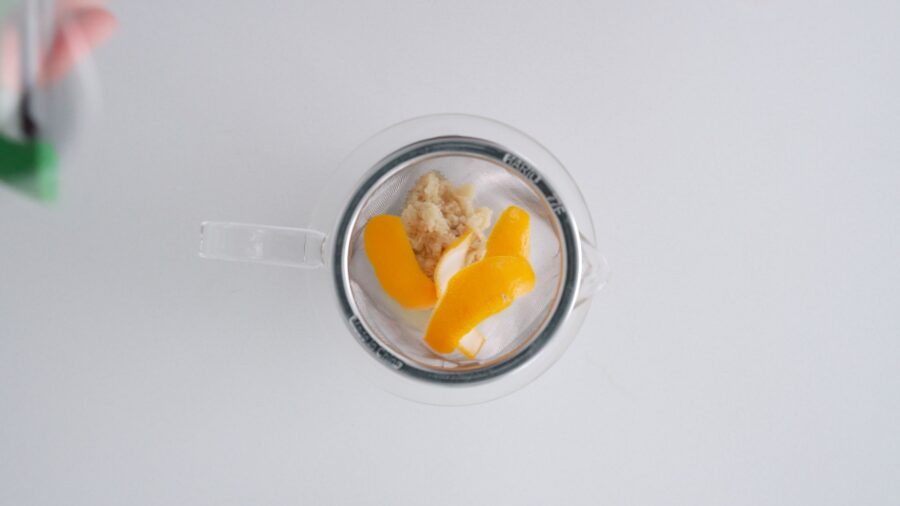 Teapot with ginger and lemon zest for making shogayu.
