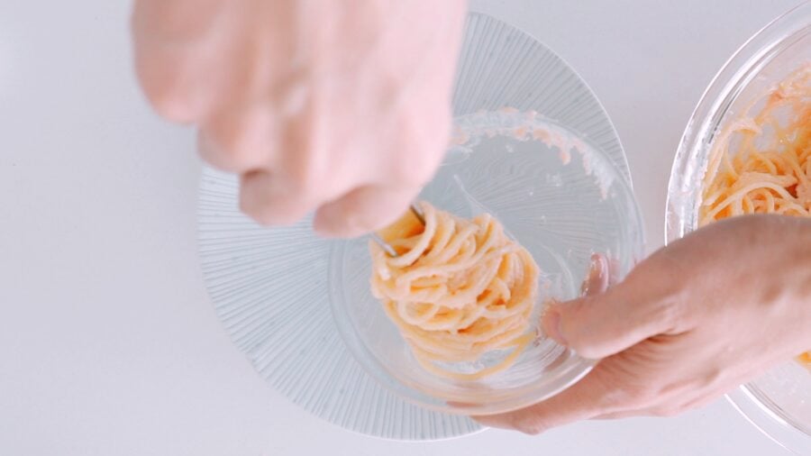 Plating Mentaiko pasta using a bowl.
