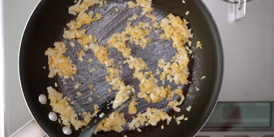 Caramelized onions in a frying pan.