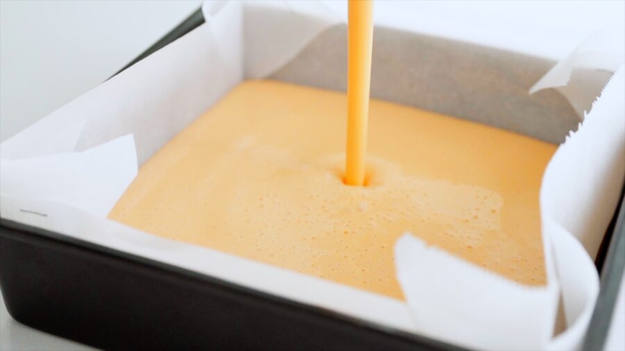 Datemaki batter being poured into prepared baking pan.