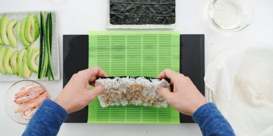 Flipping sushi rice over.