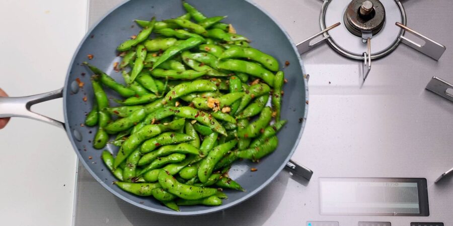 Edamame stir-fried with garlic, chili flakes and black pepper.