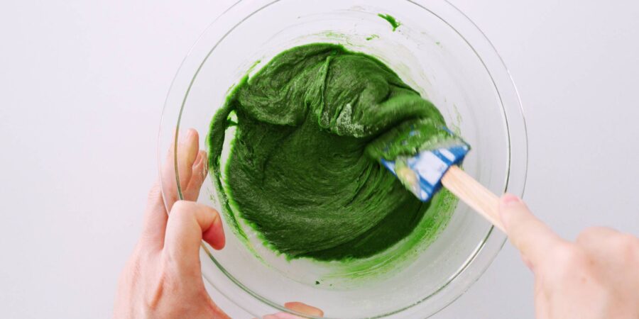 Batter for Matcha brownies in a glass bowl.