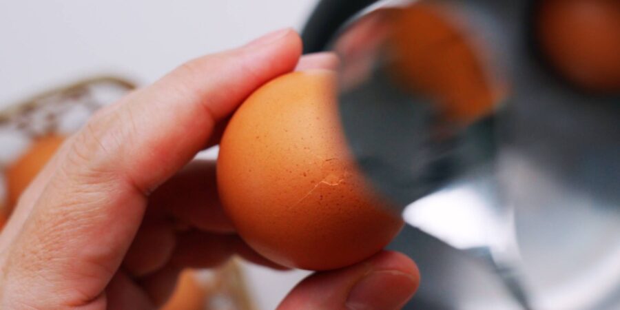 The trick for making soft-boiled eggs easier to peel is to make a small crack in the bottom.