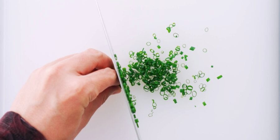 Chopping scallion greens.