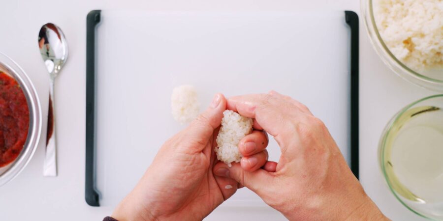 Shaping sushi rice for spicy tuna gunkan.
