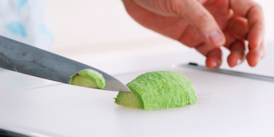 Slicing avocado for making a rose.