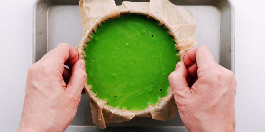 Pour the basque cheesecake batter into the prepared pan.