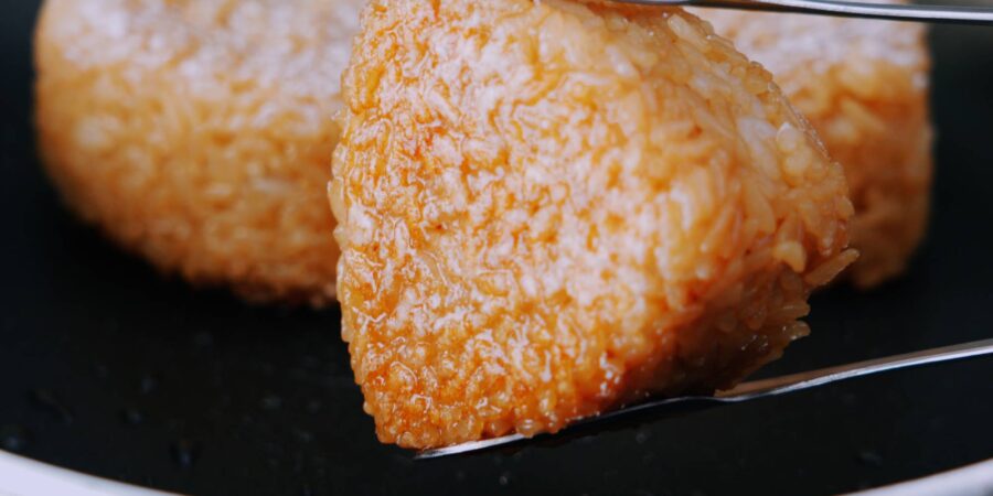 Flipping yaki onigiri over.