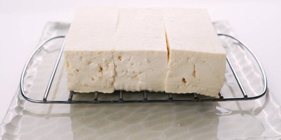 Draining tofu on wire rack.