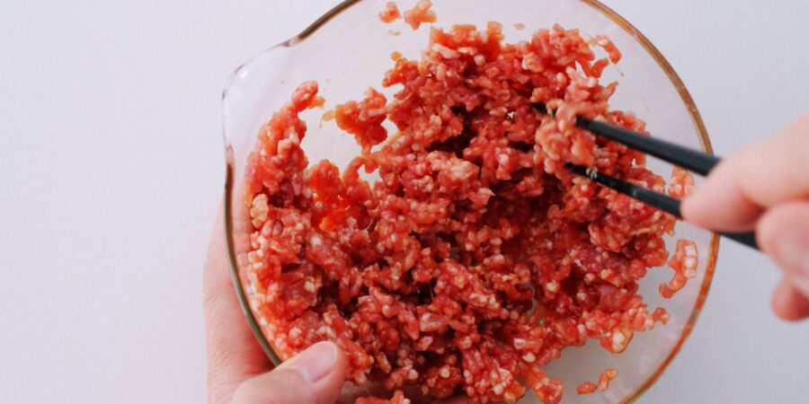 Marinating ground pork with soy sauce and mirin for Japanese-style spring rolls.