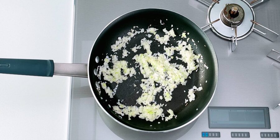 Sautéing ginger and scallion stems in a frying pan to make the filling for Harumaki.