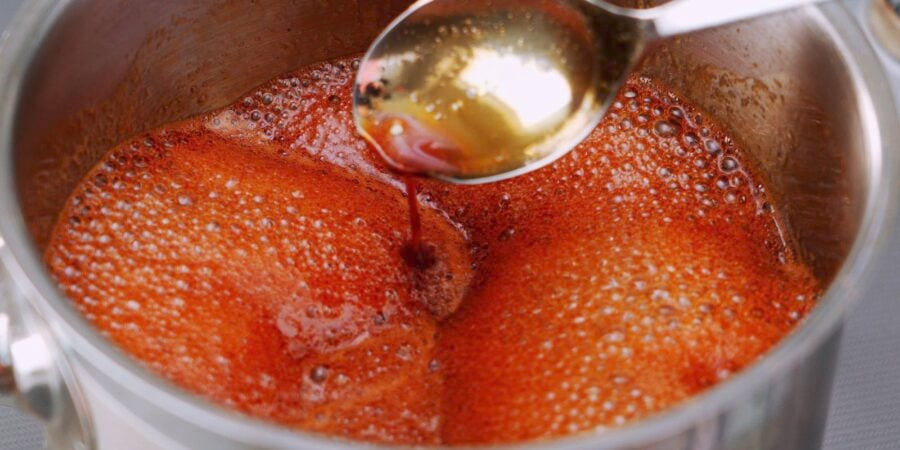 Teriyaki sauce boiling in a pot.