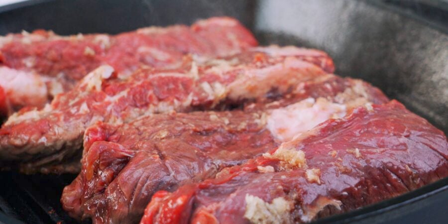 Hanger steaks on grill pan.