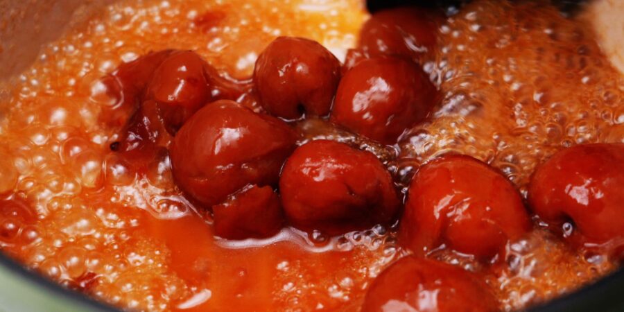 Reducing umeboshi sauce in a pot.