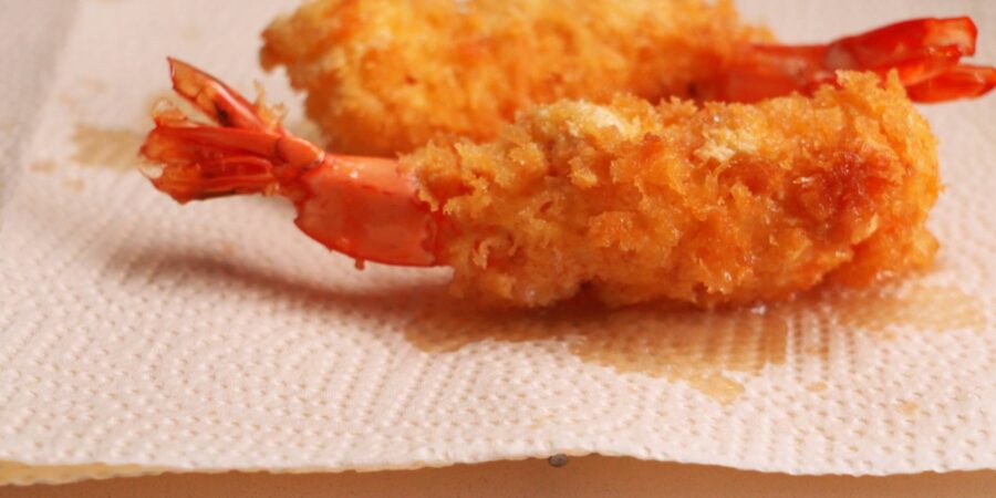 Ebi Fry or Panko fried shrimp draining on paper towels after being fried.