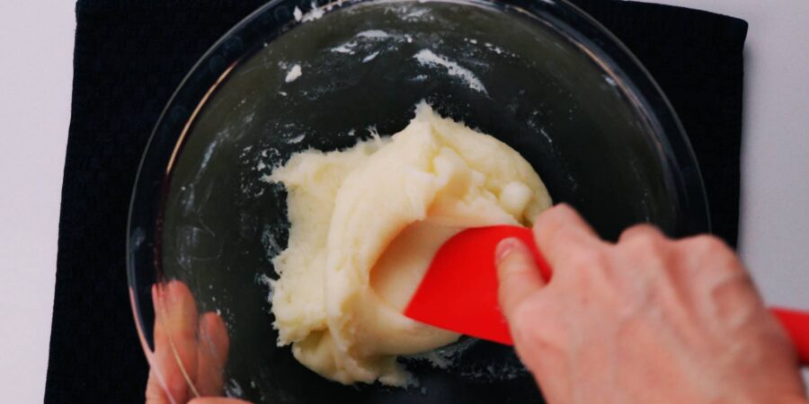 Kneading butter mochi with a spatula.