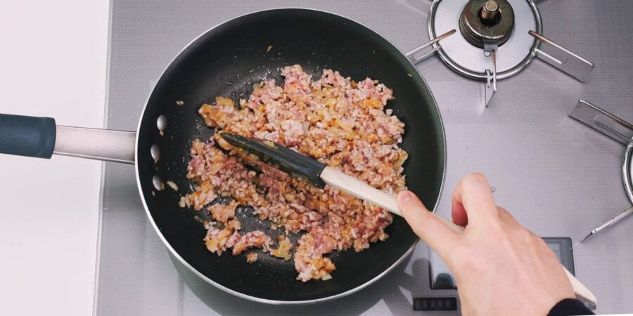 Stir-frying ground pork an aromatics for making Japanese-style Mapo Tofu.