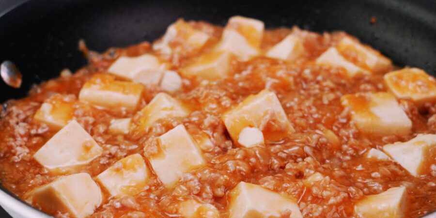 Japanese-style mapo tofu in frying pan.
