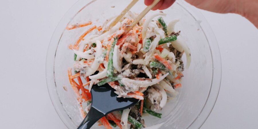 Kakiage tempura mixture being loaded onto a spatula.