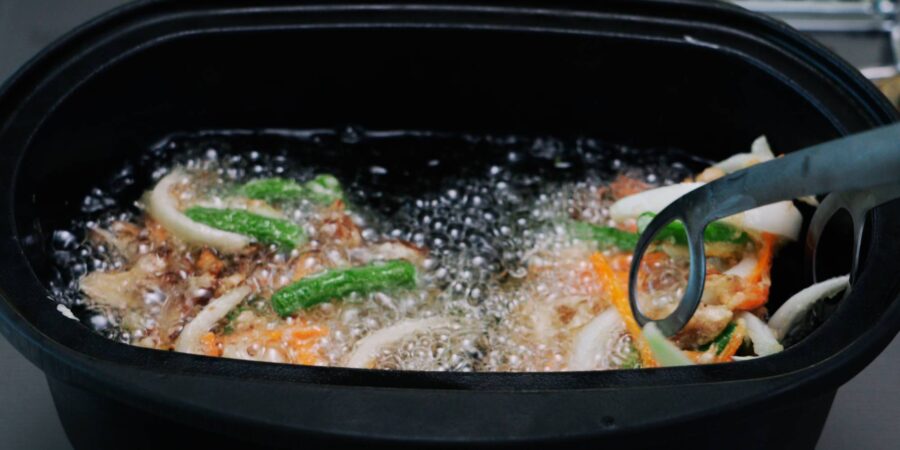 Frying a Japanese vegetable fritter, or kakiage.