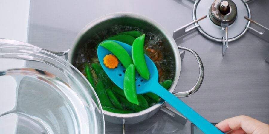 Boiled carrots and snap peas.
