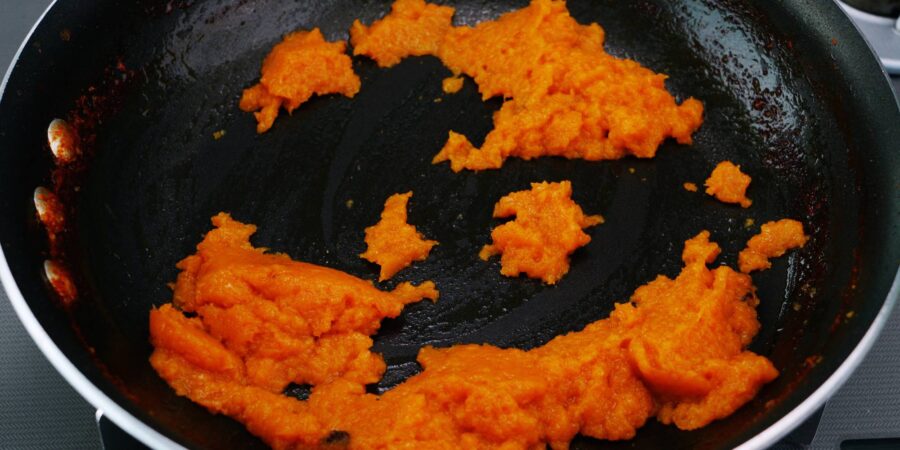 Caramelizing, onions, carrots, ginger and garlic.