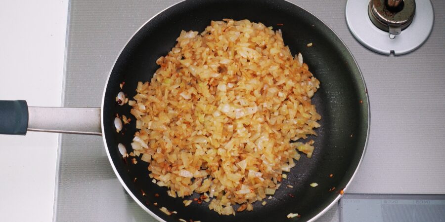 Onions browned in the pan the steak was fried in.