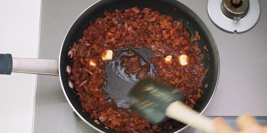 Butter being emulsified in the onion sauce for Chaliapin Steak.