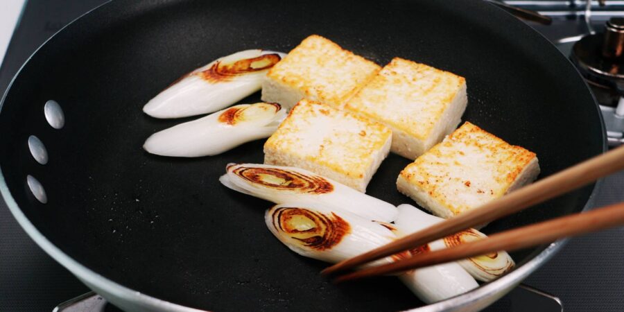 Browning scallions and tofu.