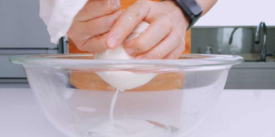 Squeeze out the excess water from the tofu.
