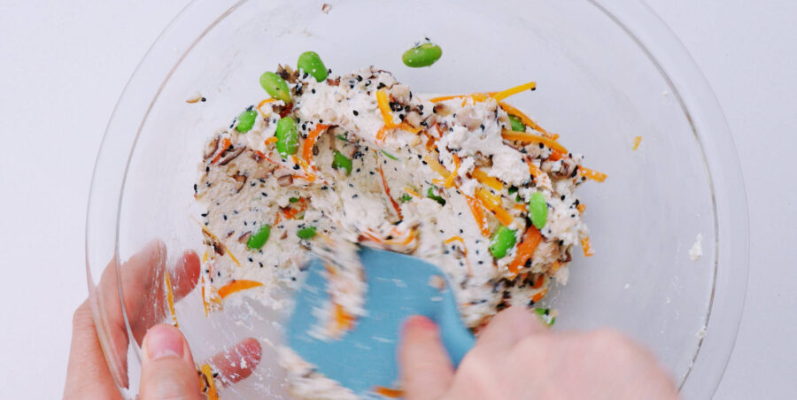 Knead the vegetables into the tofu mixture.
