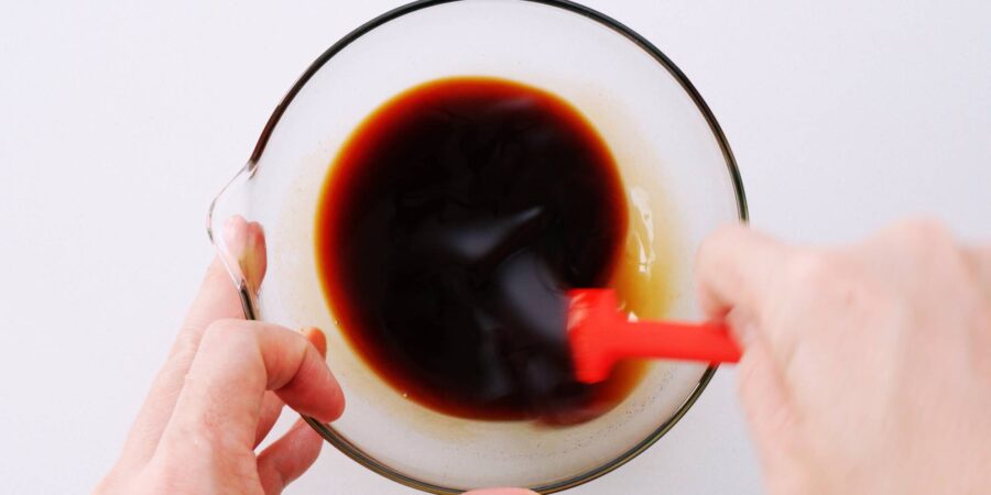 Mixing the sauce for Tonteki in a glass bowl.