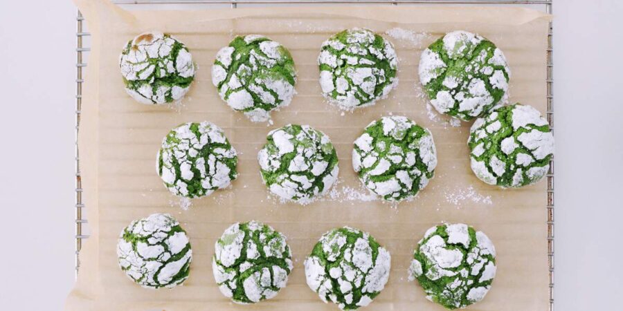 Matcha Crinkle Cookies cooling on a rack.