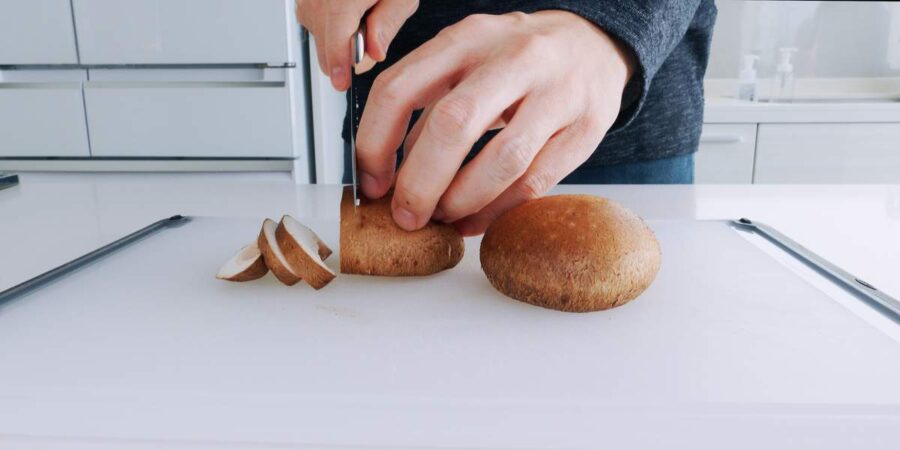 Slicing shiitake mushrooms.