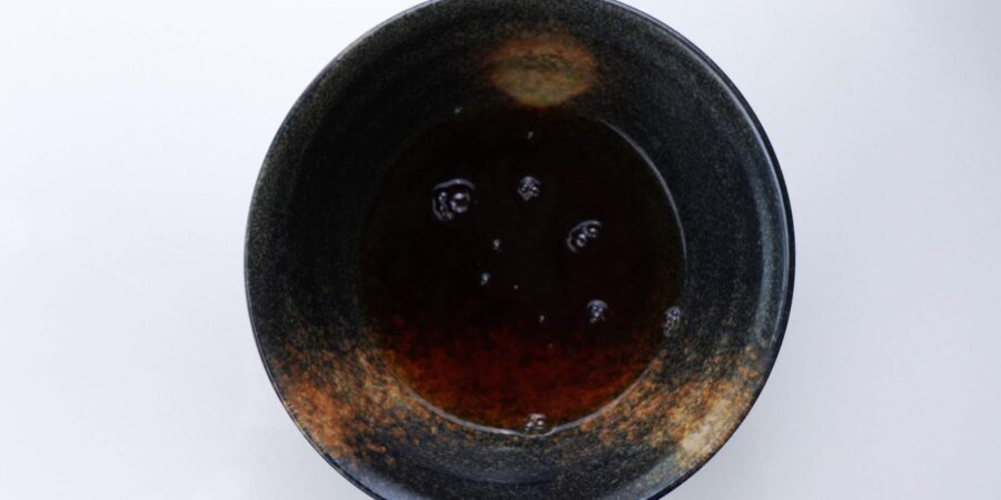 Udon broth in a serving bowl.