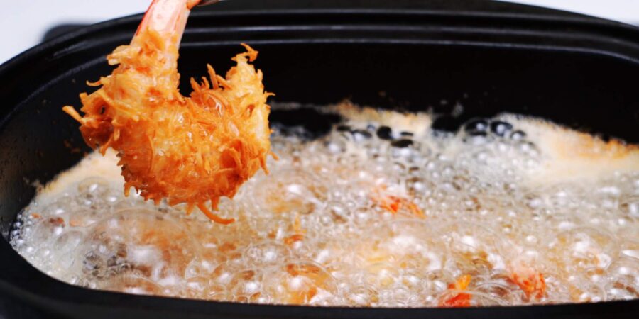 Deep frying coconut shrimp