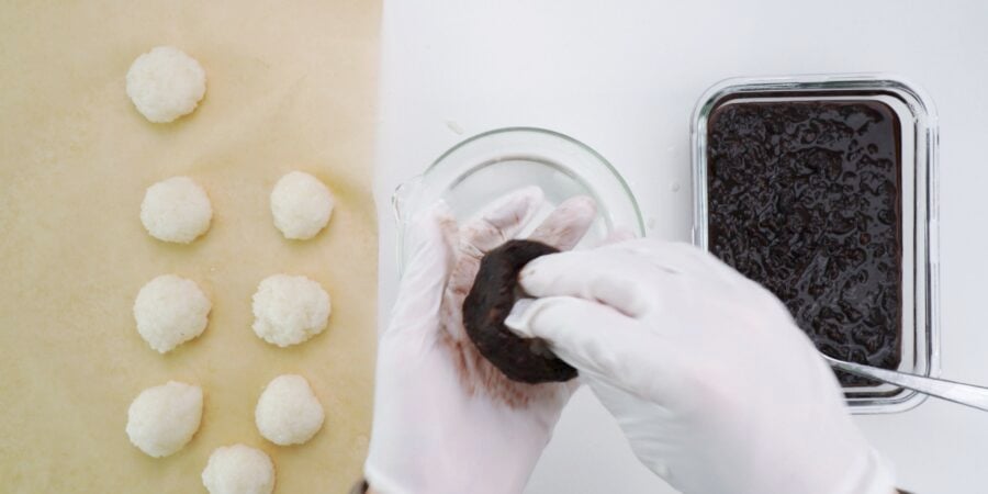 Stuffing ohagi with mochi rice.