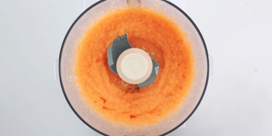 Pureed onions and carrots in food processor.